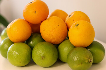 Beautiful lemons and oranges arranged on a table. A fruit rich in vitamin c.
