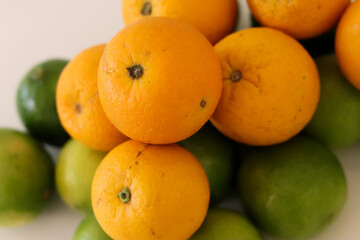 Beautiful lemons and oranges arranged on a table. A fruit rich in vitamin c.