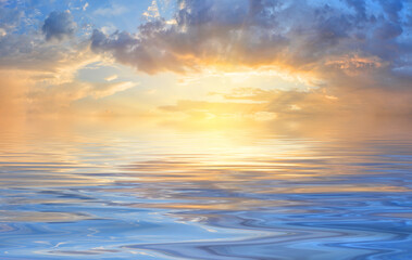 Naklejka na ściany i meble Panorama of sunset sky with bright sun over waves of the sea