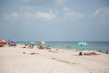 Vero Beach, Florida. July 21, 2020: Groups of people at the beach during Covid-19 coronavirus pandemic as the state is currently labeled the new US epicenter. Editorial.