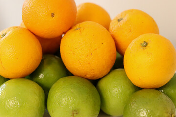 Beautiful lemons and oranges arranged on a table. A fruit rich in vitamin c.