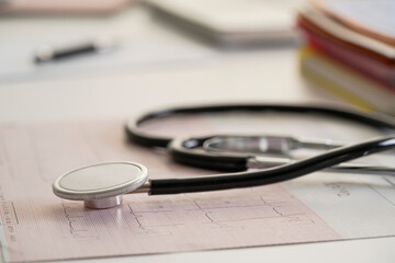 Stethoscope on medical report