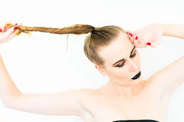 Foto op Aluminium Topless girl with black make-up and a high ponytail, pulling her hair to the side.   © Jentse