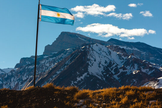 View of flag with mountains in background