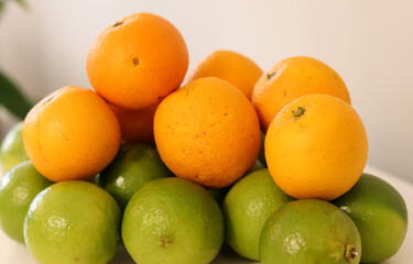 Beautiful lemons and oranges arranged on a table. A fruit rich in vitamin c.