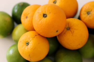 Beautiful lemons and oranges arranged on a table. A fruit rich in vitamin c.