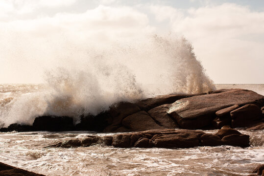 Waves splashing on rock