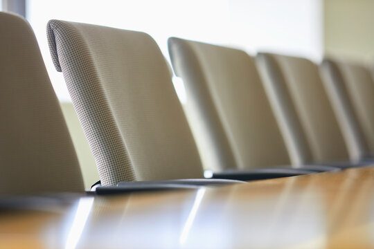 Office chairs in row at table