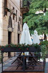 outdoor empty terraces in Italy, empty tables due to coronavirus panic. deserted terrace due to quarantine time