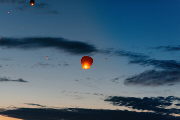 In the evening, at sunset, people with their relatives and friends launch traditional lanterns. Tradition and travel