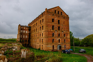 Abandoned red brick industrial building, ruined former water mill
