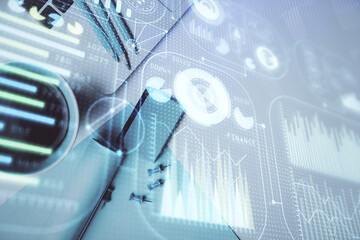 Multi exposure of data drawing hologram over topview of study desk background with computer. Concept of technology.