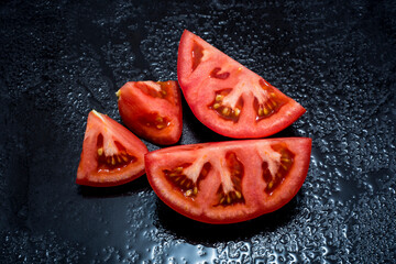 Healthy tomato cut with olive oil and herbs, typical food of the Mediterranean diet