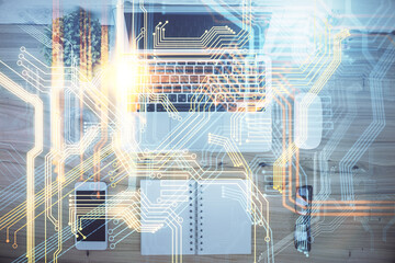 Double exposure of map hologram drawing over study table background with computer. Concept of international network. Top view.