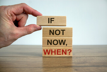 Male hand placing a blocks with word 'if' on top of a blocks tower. Text 'if not now, when'....