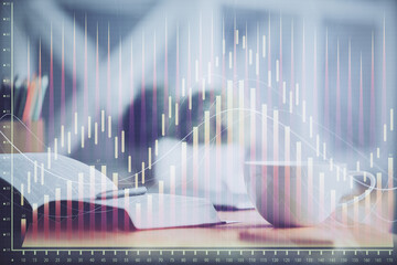 Multi exposure of forex graph drawing and desktop with coffee and items on table background. Concept of financial market trading