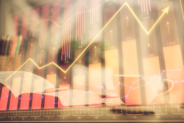 Multi exposure of forex graph drawing and desktop with coffee and items on table background. Concept of financial market trading