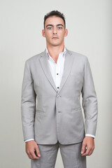 Fototapeta premium Portrait of young handsome businessman wearing suit