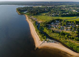 Aerial ocean coastal view, beautiful sand beach town stretching into the distance