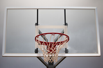 Close up of a netted basketball hoop ready for some b-ball action.