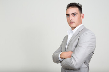 Portrait of young handsome businessman wearing suit