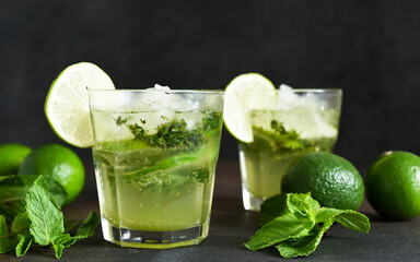 Summer cocktail. Classic summer drink - mojito in a glass on a dark background.