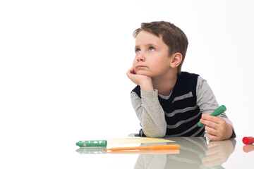 caucasian boy studying at home with expression of ideas and thoughts  with white background, concept of home schooling