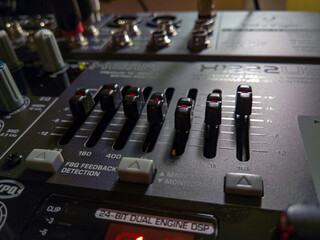 Close-up on the equalizer section of the mixer Behringer Xenyx X1222