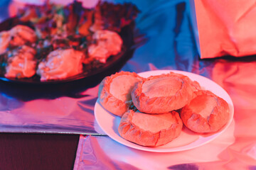 Traditional russian chicken pie kurnik on a plate laying on a table napkin, top view, horizontal. © Евгений Вершинин