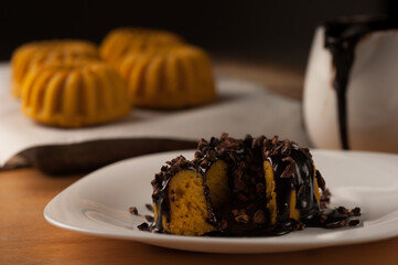 Carrot cake with chocolate syrup in a breakfast table