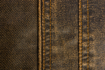 clothing items stonewashed cotton fabric texture with seams, clasps, buttons and rivets, macro