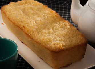 Cassava cake and tea pot in a breakfast table