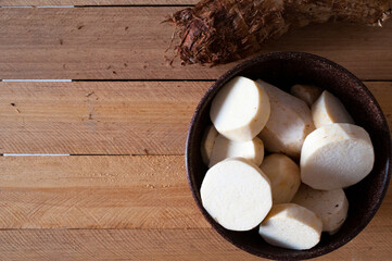 fresh yam in a bowl. Yam roots. Top view