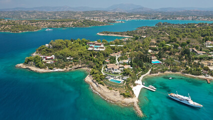 Aerial drone photo of Chinitsa bay a popular anchorage crystal clear turquoise sea bay for yachts and sail boats next to Porto Heli, Saronic gulf, Greece