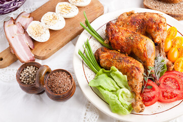 Grilled chicken wings with tomatoes and vegetables