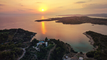 Fototapeta na wymiar Aerial drone panoramic photo of famous fjord seaside village and bay of Porto Heli in the heart of Argolida prefecture at sunset, Peloponnese, Greece