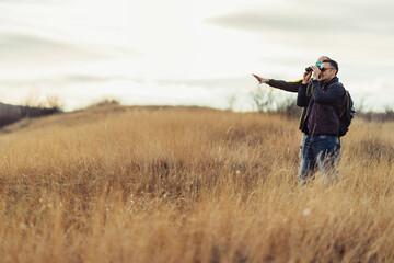Friends explore nature with binoculars