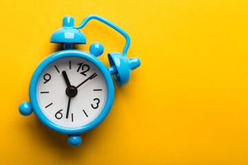 Clock Isolated On Yellow Background