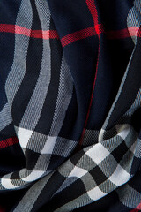 vertical top view closeup crumpled black checked scarf with different strips