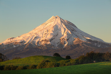 Fototapeta premium Rolling green pastures and mountain II