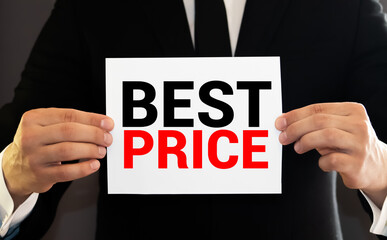 Obraz premium Word writing text Best Price. Business concept for the lowest or great price that a buyer can buy something for Trendy metallic laptop clips pencil squared paper sheet colored background.