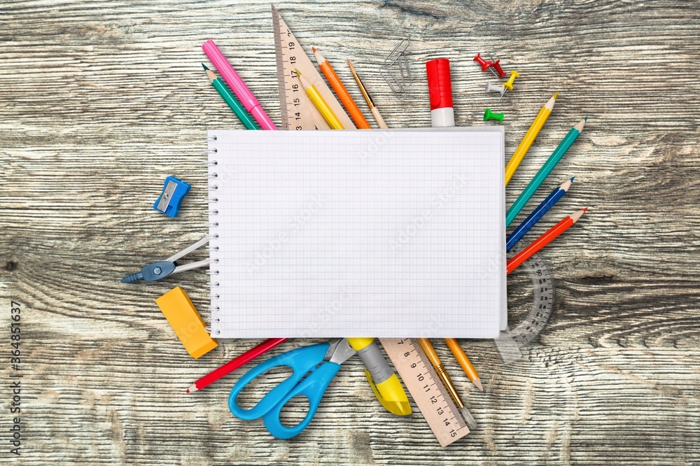 Poster An assortment of colored school supplies on the desk