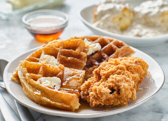 fried chicken and waffles breakfast with syrup