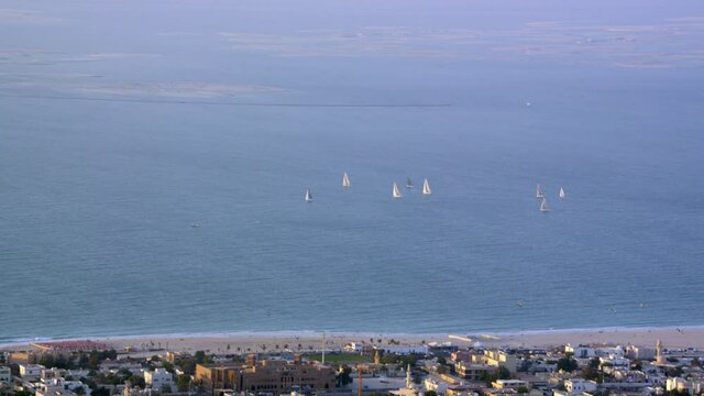 A wonderful sight of Beach Landscapes were several sailboats on the horizon zooming out reveling the famous World Island of Duba  Shotover F1, 8K, zoom in and out, parallax,