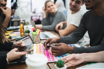 Multiethnic creative people having a brainstorming meeting.
