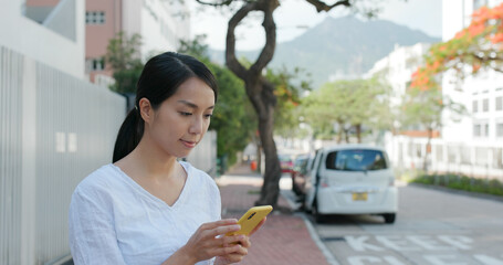 Woman use of cellphone in city