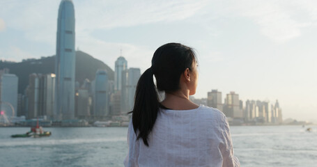 Woman looks at city in Hong Kong