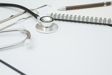 Stethoscope, Document Board, Notebook, Pen  on white background and copy space
