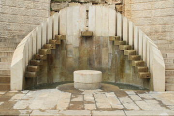 old stone stairs and water font