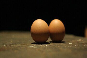 Up close view of 2 eggs in the dark